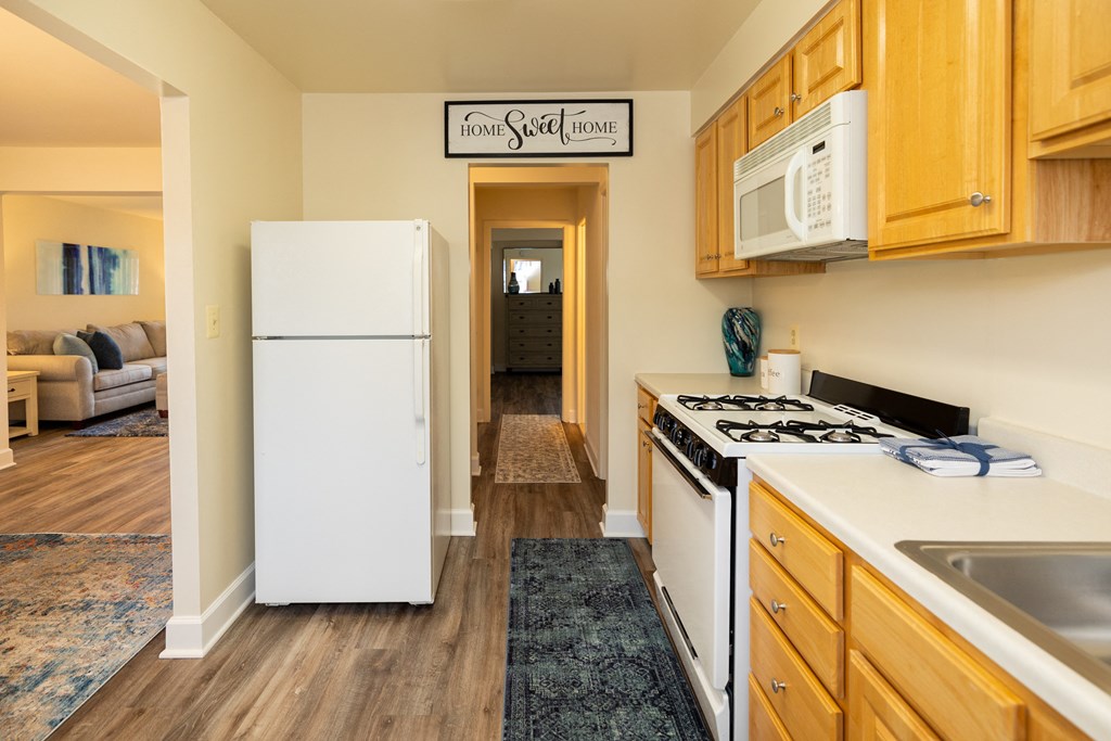Kitchen with white appliances at Rockdale Gardens Apartments*, Baltimore, MD