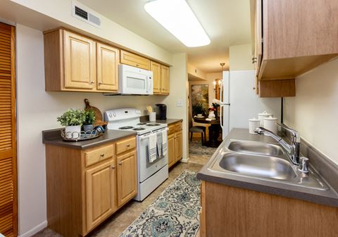 Large eat in kitchen with washer and dryer in unit at Spring Hill Apartments & Townhomes, Baltimore, MD
