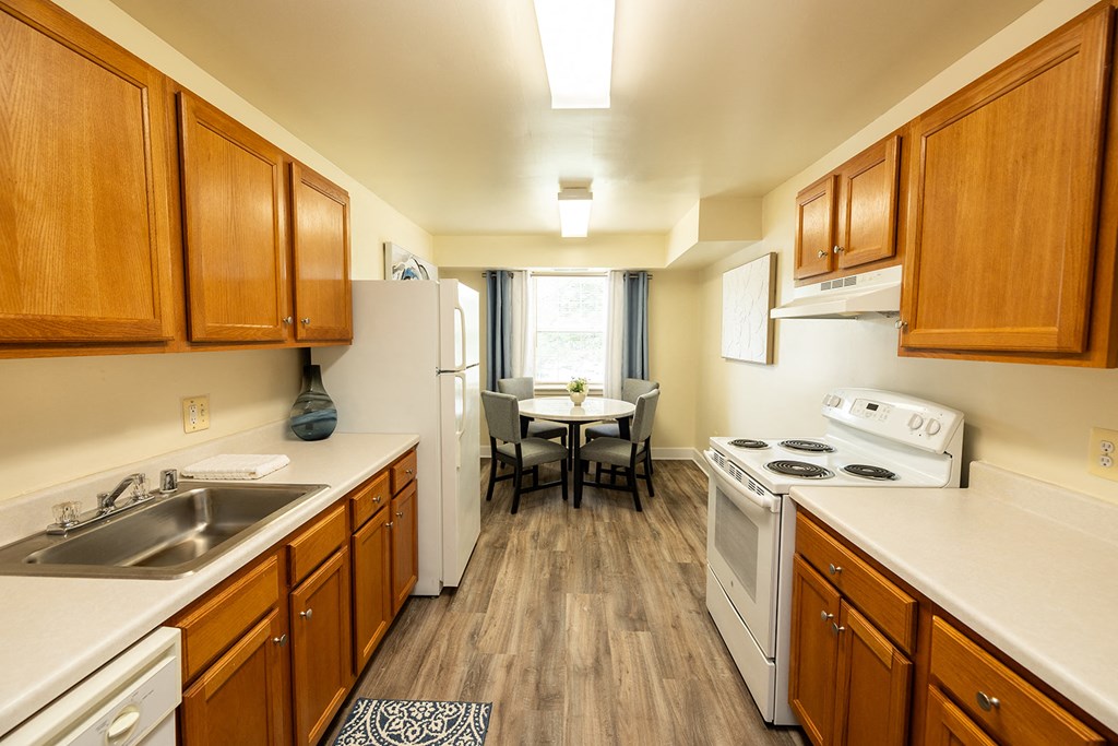 Apartment kitchen and dining room at Woodbridge Apartments located in Randallstown, MD
