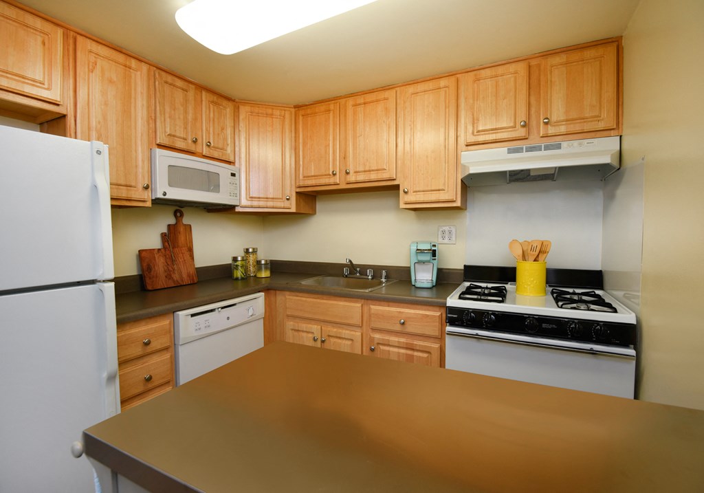 Bright kitchen with plenty of cabinets at Winston Apartments, Baltimore, 21239
