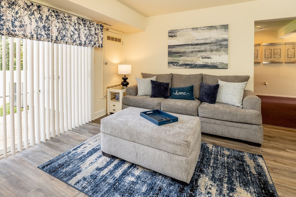 Living room with a gray couch at Seven Oaks Townhomes, Edgewood