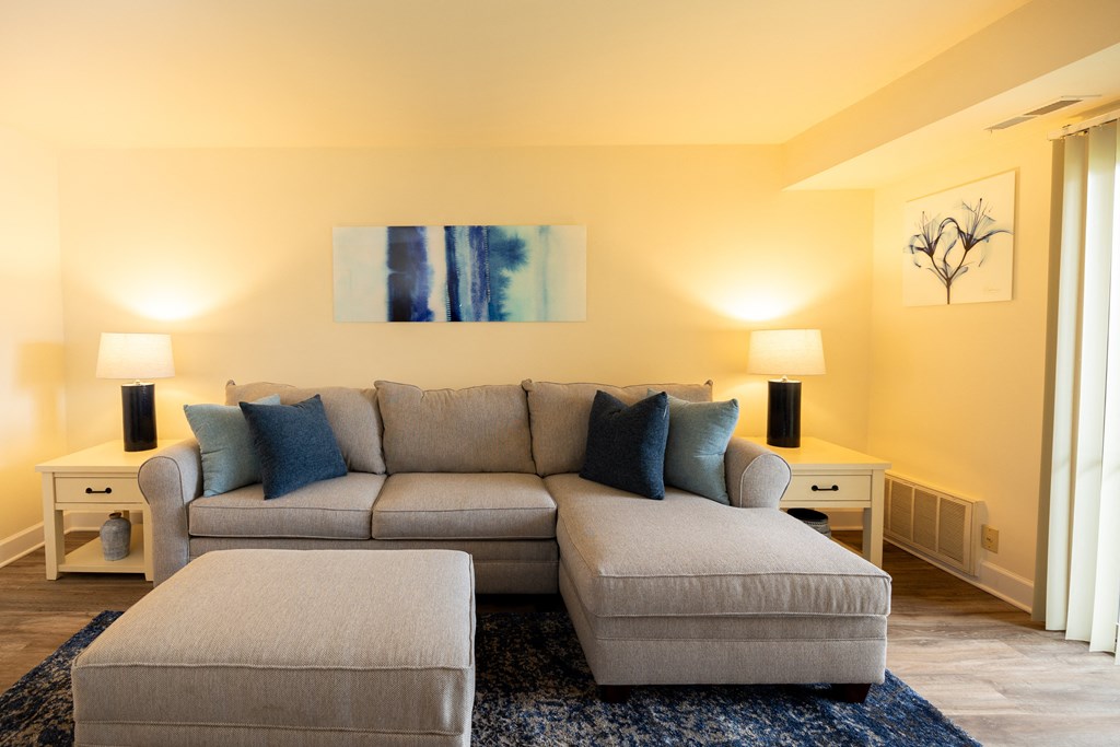 Living room with a couch and a chairat Rockdale Gardens Apartments*, Baltimore, MD