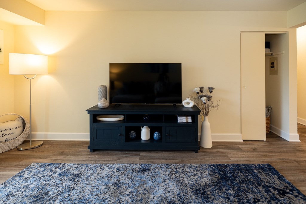 Living room with a tv at Rockdale Gardens Apartments*, Baltimore, MD