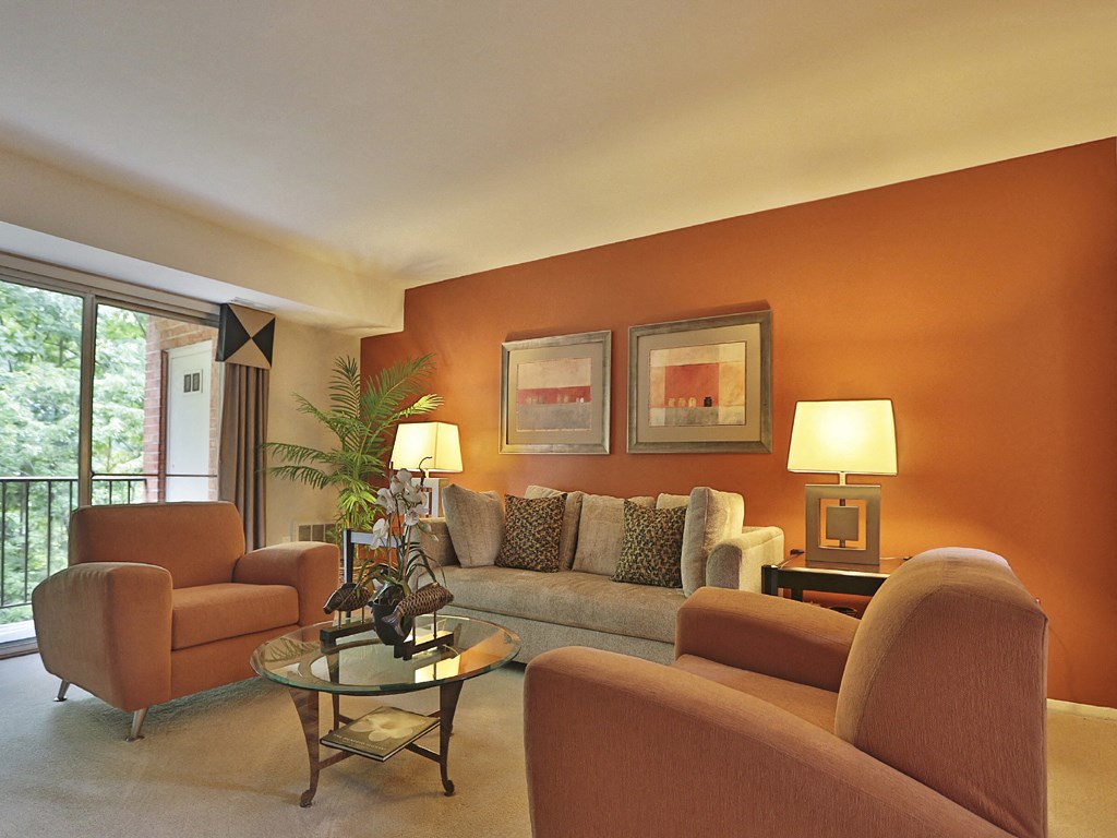 Large living room with private balcony at Liberty Gardens Apartments, Baltimore, MD