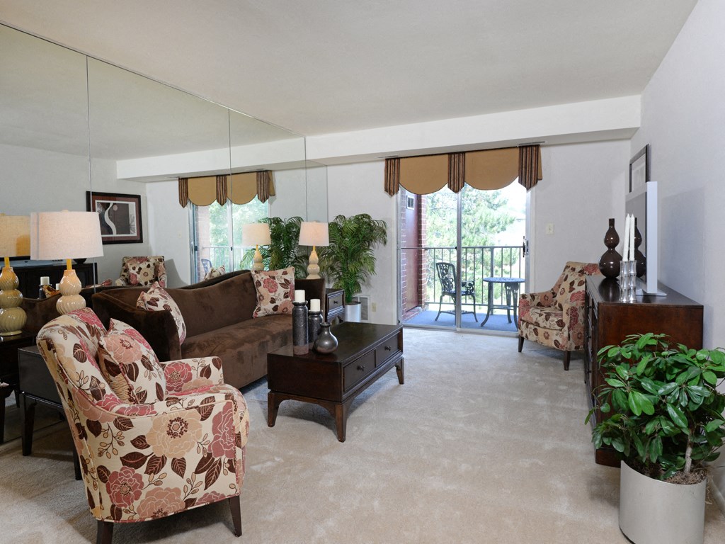Living room with private balcony at Rockdale Gardens Apartments*, Baltimore, 21244