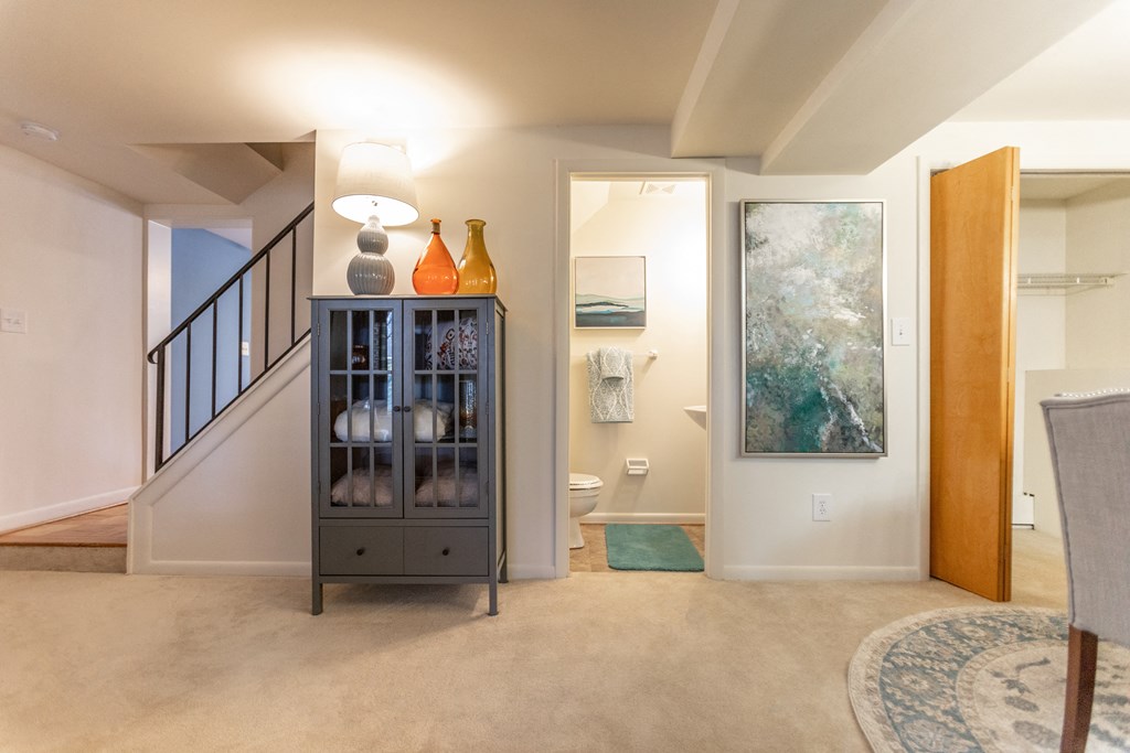 Living area with door to the bathroom at Spring Hill Apartments & Townhomes, Baltimore