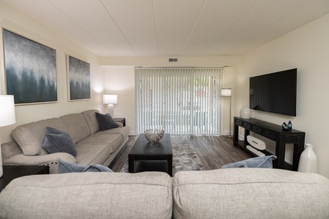 Living room with a couch and a tv at Ivy Hall Apartments*, Towson, MD 21204