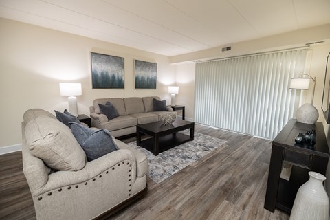 Living room with a couch and a tv at Ivy Hall Apartments*, Towson, MD 21204