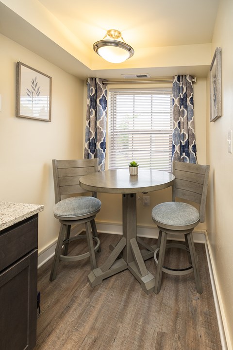 Eat-in kitchen with table and window at Seminary Roundtop Apartments, Lutherville, Maryland, 21093