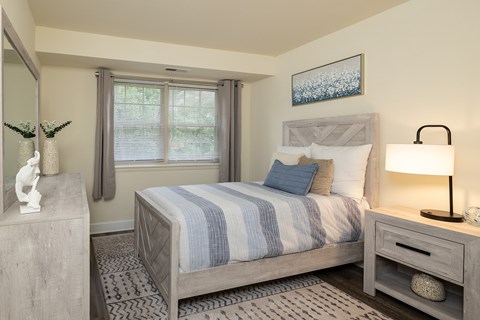 Second bedroom with bed, nightstand and window at Village of Pine Run Apartments & Townhomes*, Maryland, 21244