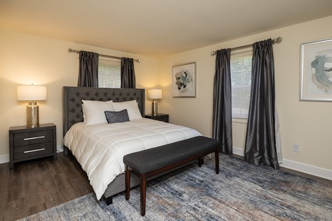 A bedroom with bed and windows at Spring Hill Apartments & Townhomes, Baltimore, MD 21234