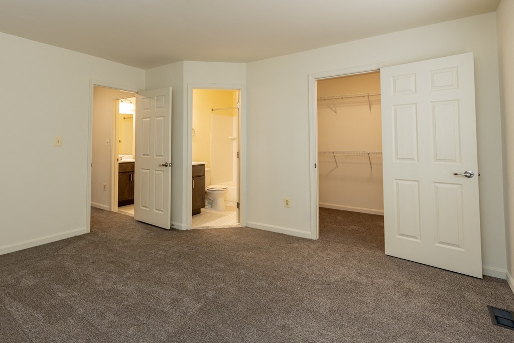 a bedroom with a closet and a toilet at Carlson Woods Townhomes, Baltimore