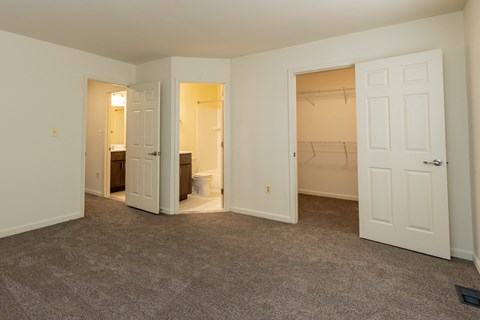 a bedroom with a closet and a toilet at Carlson Woods Townhomes, Baltimore