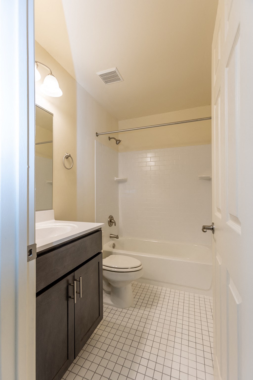 a bathroom with a toilet sink and bathtub at Carlson Woods Townhomes, Maryland