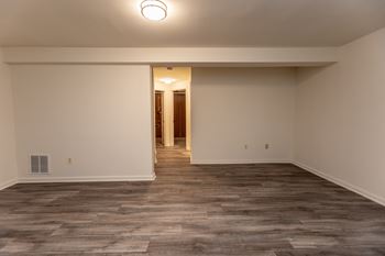 a bedroom with floor and white walls at Carlson Woods Townhomes, Baltimore