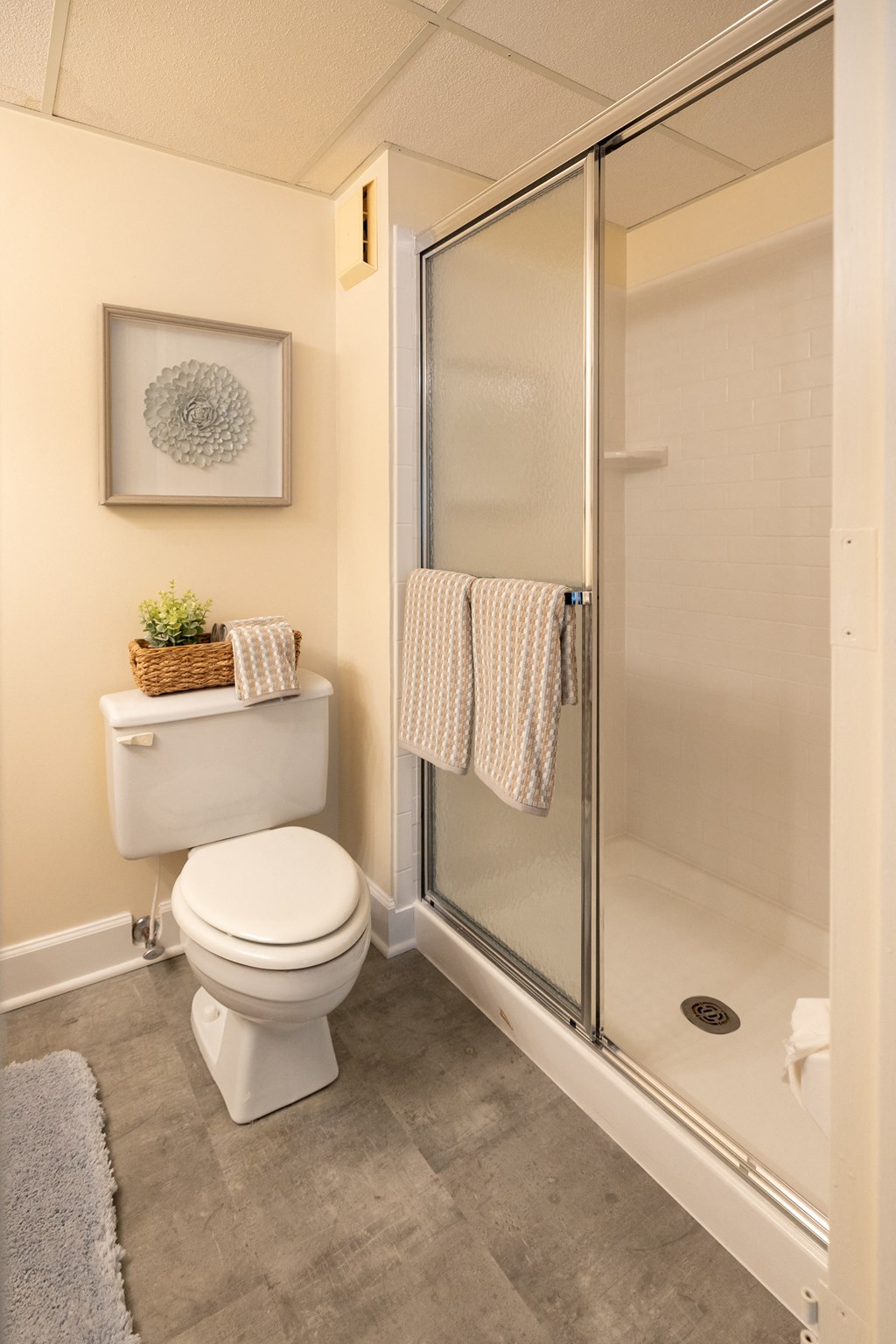 Small bathroom with a toilet and a shower at Ivy Hall Apartments*, Towson, MD 21204
