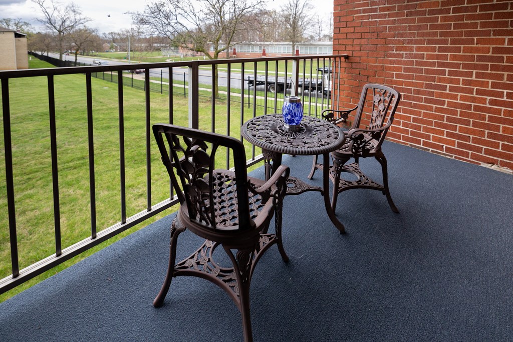 Balcony with two chairs at Rockdale Gardens Apartments*, Baltimore, MD