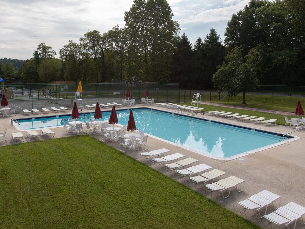 Swimming pool with chairs at Cromwell Valley Apartments, 15 Treeway Court, 2A, Towson