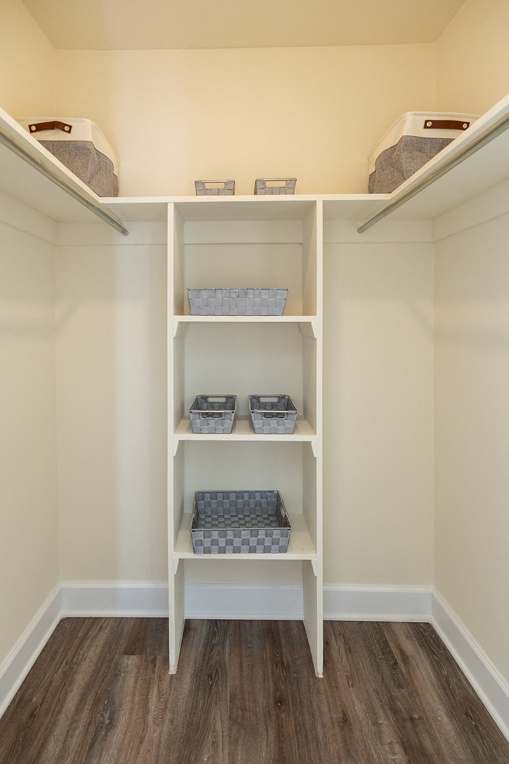 Walk-in closet in the primary bedroom at Woodridge Apartments.