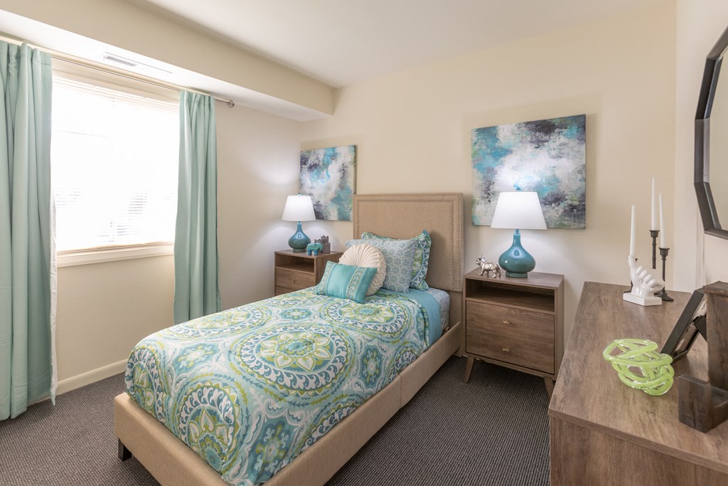 a bedroom with a bed and two night stands at Lawyers Hill Apartments, Elkridge, 21075
