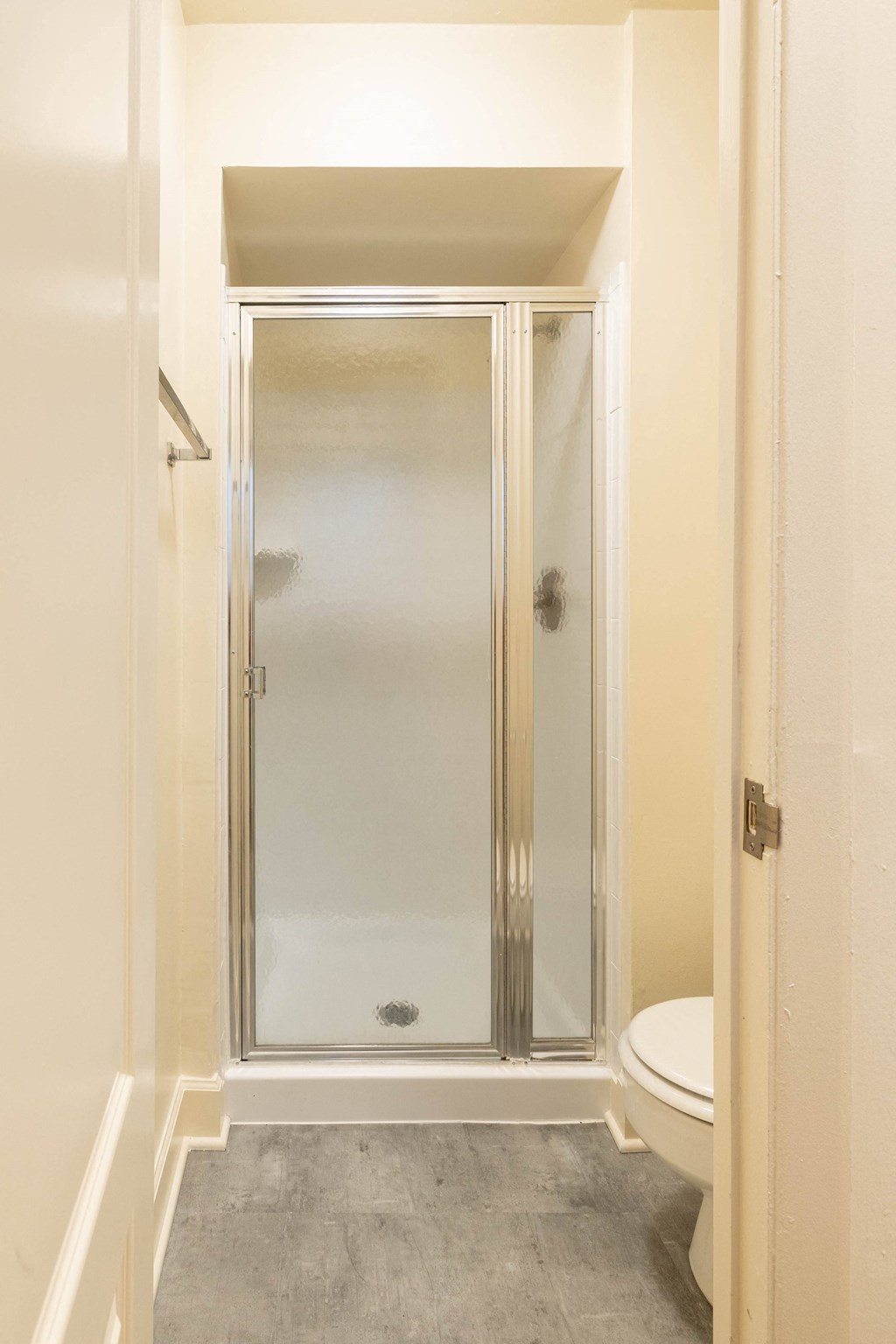 a bathroom with a shower and toilet in a 555 waverly unit  at Charlesgate Apartments, Maryland