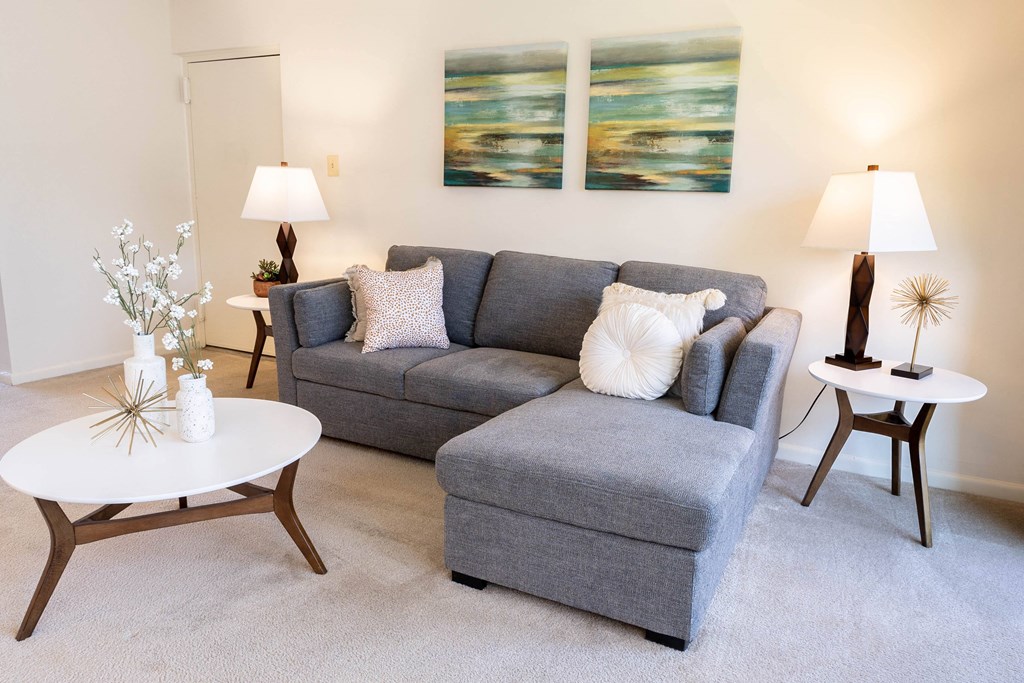 Living room with a couch and a coffee table at Village of Pine Run Apartments & Townhomes*, Baltimore, MD