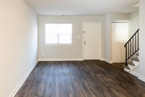 Bedroom with hardwood floors and white walls at McDonogh Village Apartments & Townhomes, Randallstown, 21133