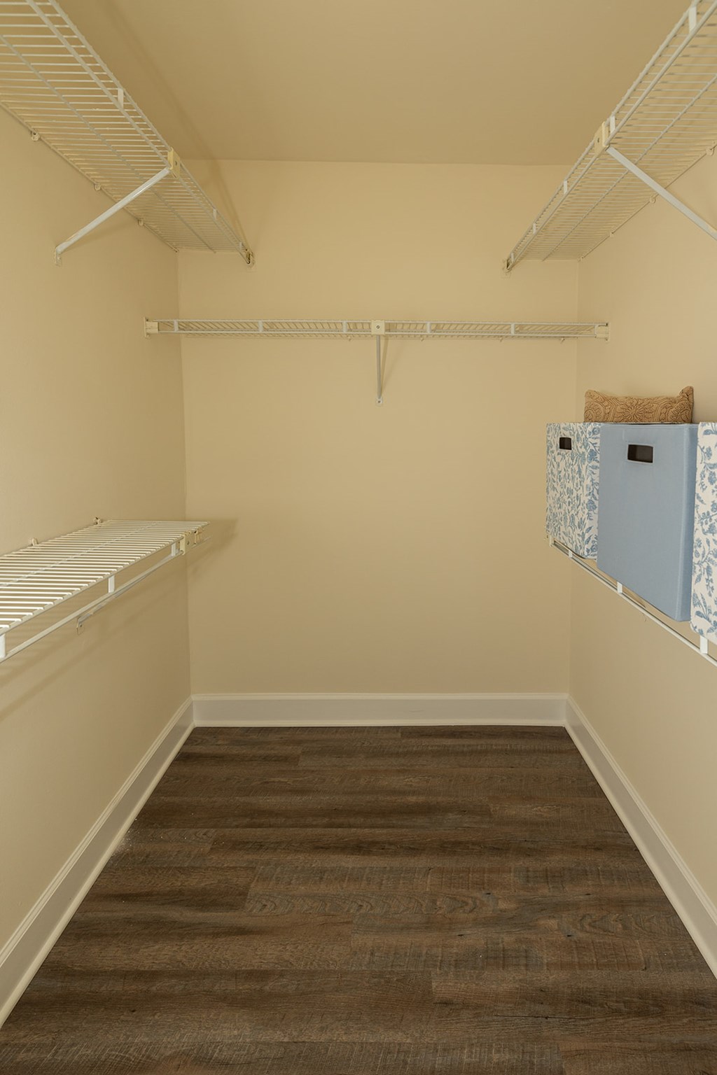 A room with a brown carpet and white walls at The Brittany Apartments, Pikesville, MD