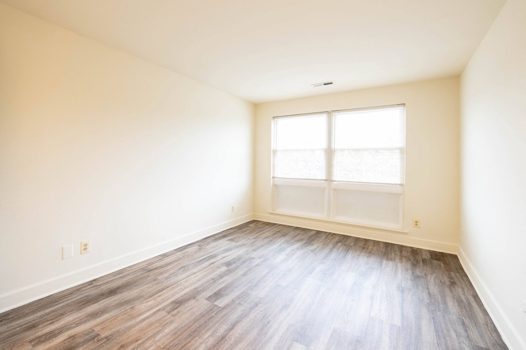 Empty room with a large window and white walls  at Charlesgate Apartments, Towson, MD, 21204