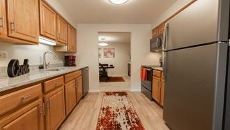 Refrigerator and Kitchen Cabinets at Cromwell Valley Apartments, Towson