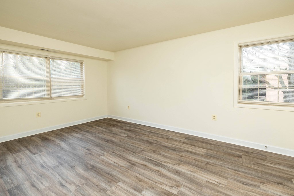 Bedroom with hardwood flooring and two windows at Seminary Roundtop Apartments, Lutherville, MD, 21093