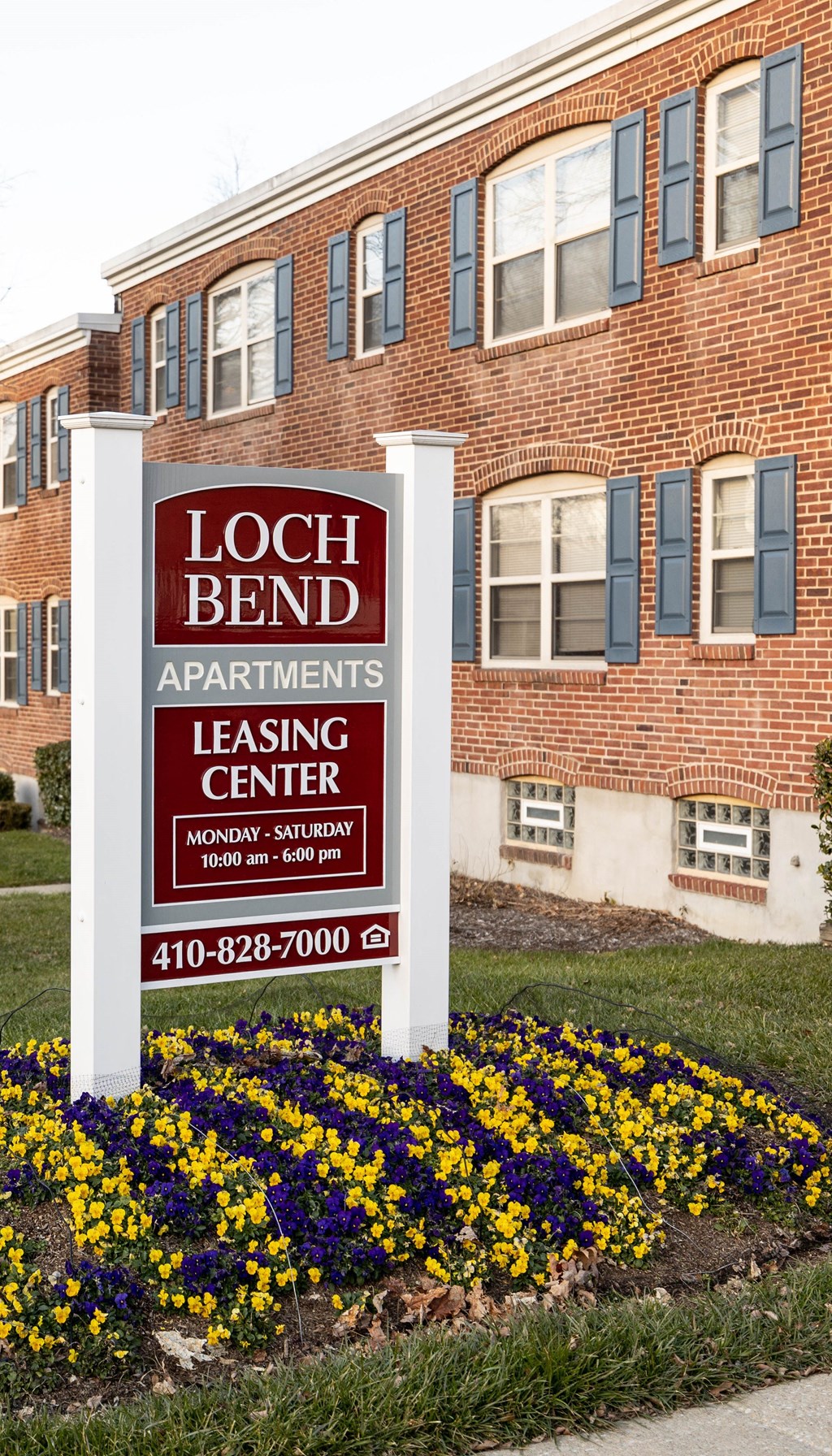 a sign in front of a building that says loch bend apartments leasing center at Loch Bend Apartments, Baltimore, Maryland