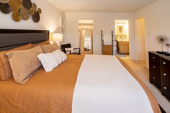 bedroom with a large bed and a bathroom at Village of Pine Run Apartments & Townhomes*, Baltimore