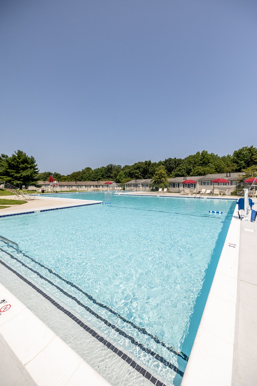 Large pool with a clear blue sky in the background at Seven Oaks Townhomes, Edgewoode, MD, 21040