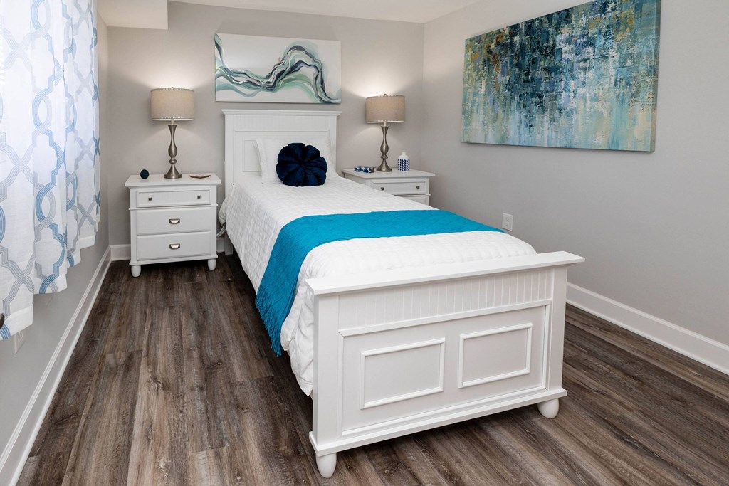 A bedroom with a bed and two night stands at Fairbrook Park, Baltimore, MD