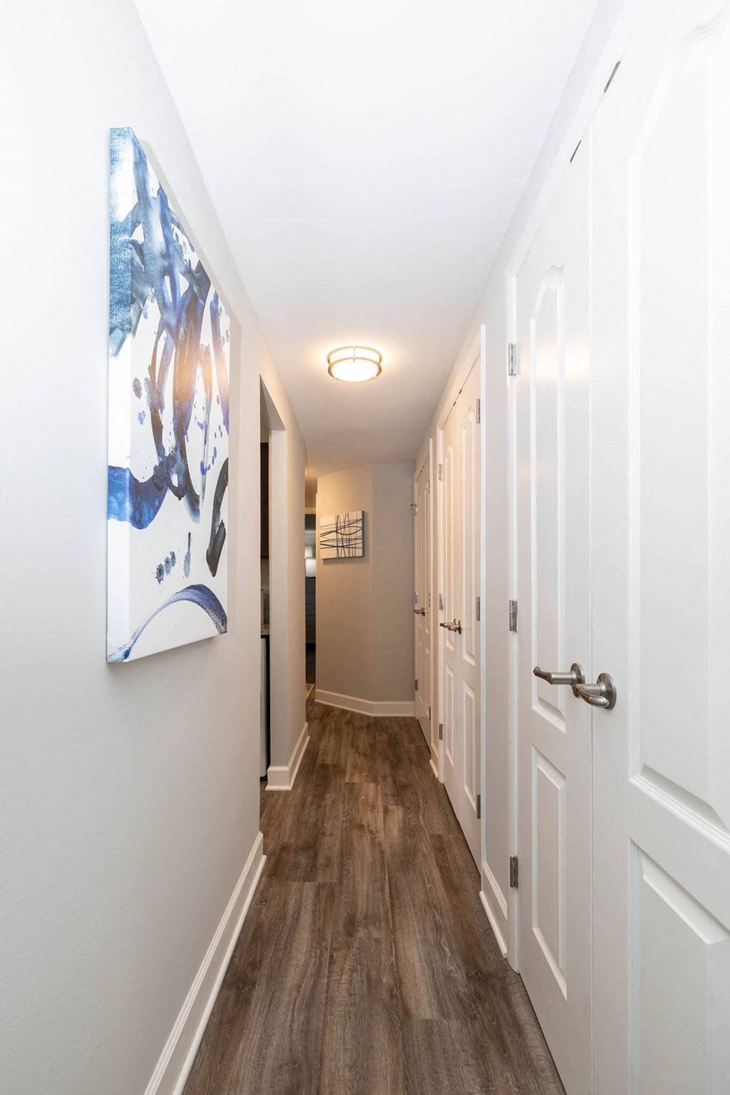 a hallway with a painting on the wall at Fairbrook Park, Baltimore, MD 21244
