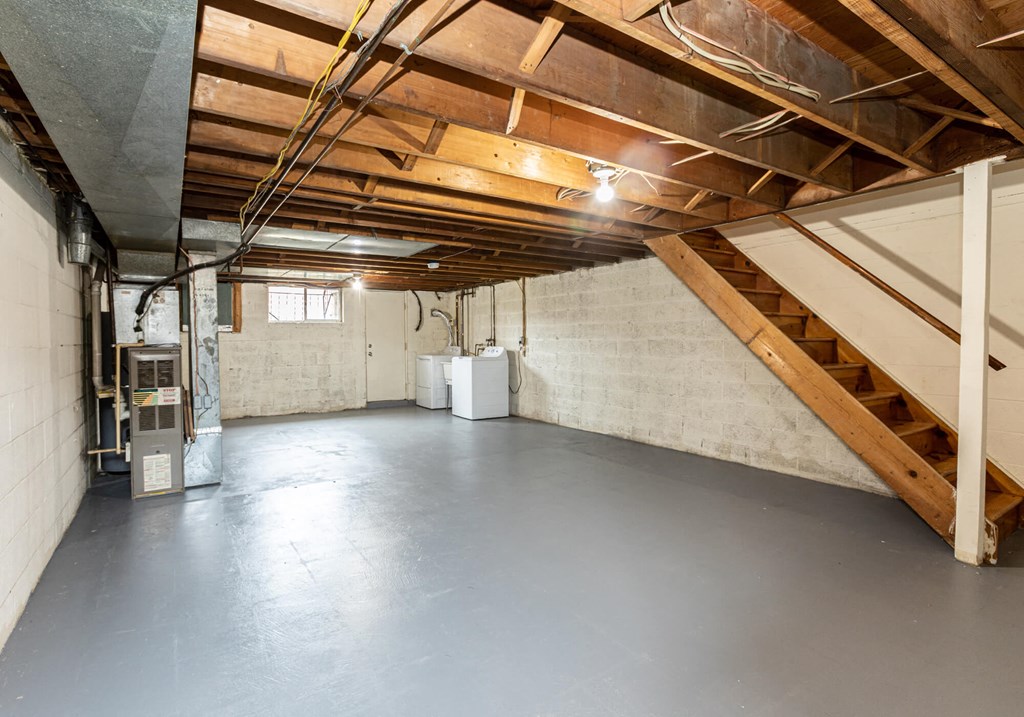 Large unfinished basement with washer and dryer at Foxridge Townhomes, Baltimore