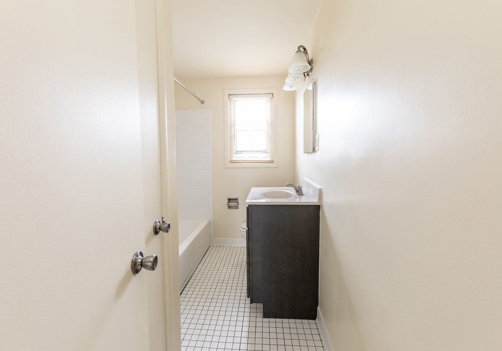 a bathroom with a sink and bathtub at Foxridge Townhomes, Maryland, 21221
