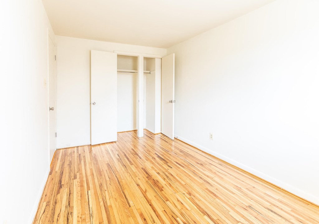 First bedroom with closets at Foxridge Townhomes, Baltimore, 21221