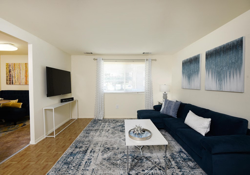 Spacious living room with a ton of natural light at Winston Apartments, Baltimore, MD 21239