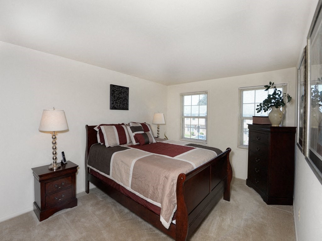 Bedroom with a bed and two night stands at Yorktowne Townhomes Apartments, Hanover Pennsylvania
