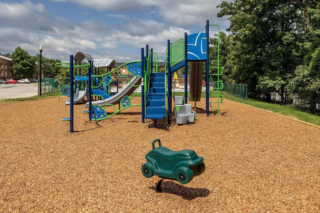Colorful playground with slides and monkey bars at Security Park Apartments*, Windsor Mill, Maryland