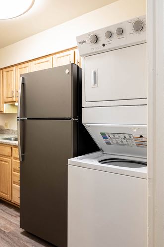 a kitchen with a refrigerator and a dishwasher  at Charlesgate Apartments, Towson, MD