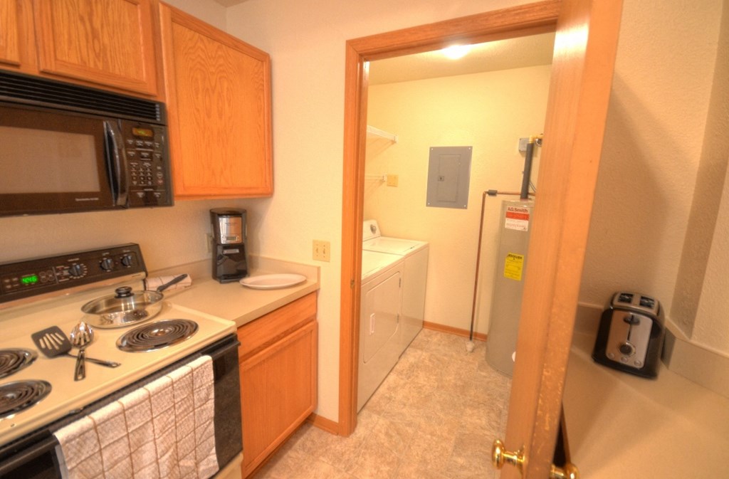 a kitchen to the laundry room