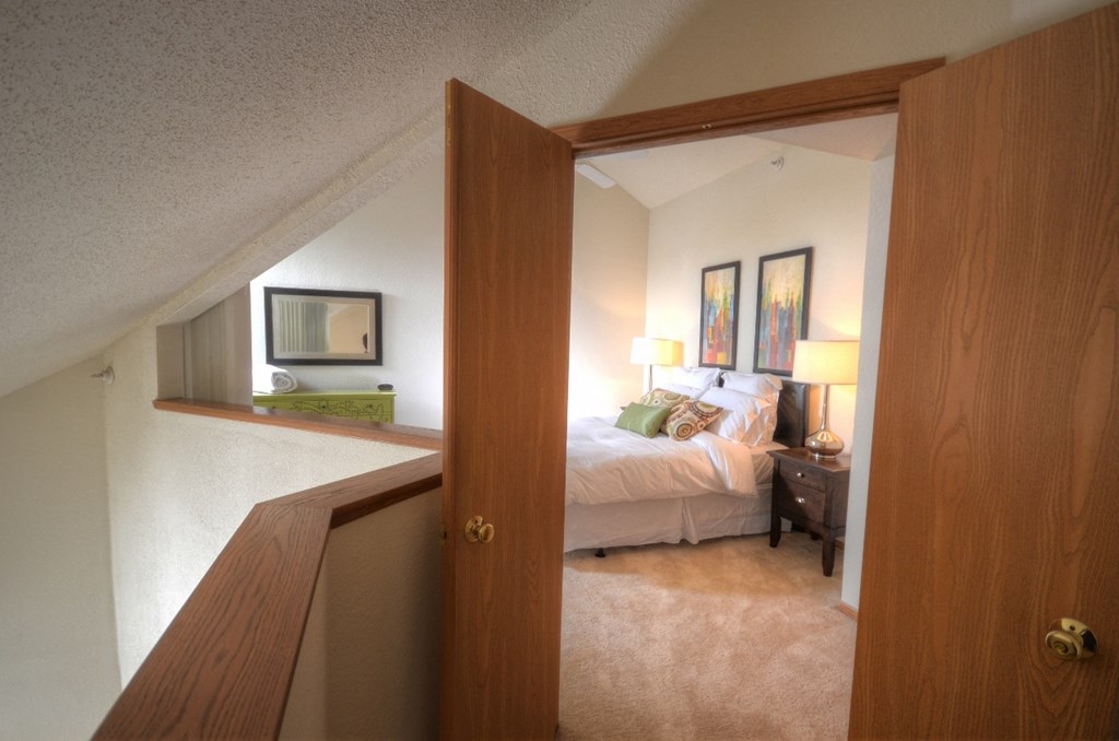 the view into the bedroom from the loft