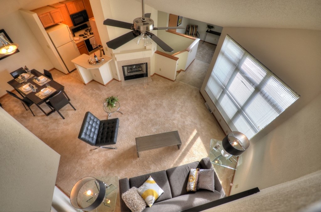 an overhead view of a living room and dining room from above