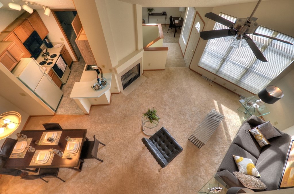 an overhead view of a living room with a ceiling fan