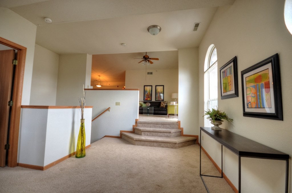 the view of the entryway from the living room into the dining room