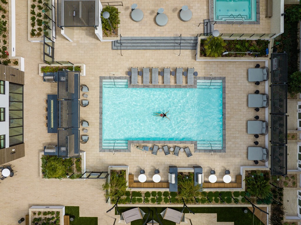 Large outdoor pool amenity at Sixth & Jackson apartments in San Jose.