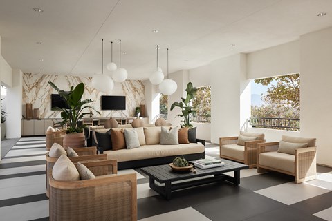 a living room with couches and chairs and a table